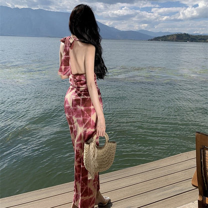 2025 Sexy hollow waist printing bow split hip dress summer new temperament backless vacation dress