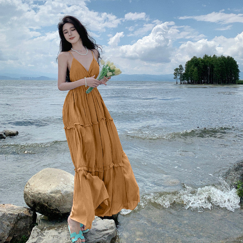 2025 Sanya seaside vacation skirt summer new sexy backless splicing ruffle leaf edge slim pendulum V-neck long skirt suspender skirt