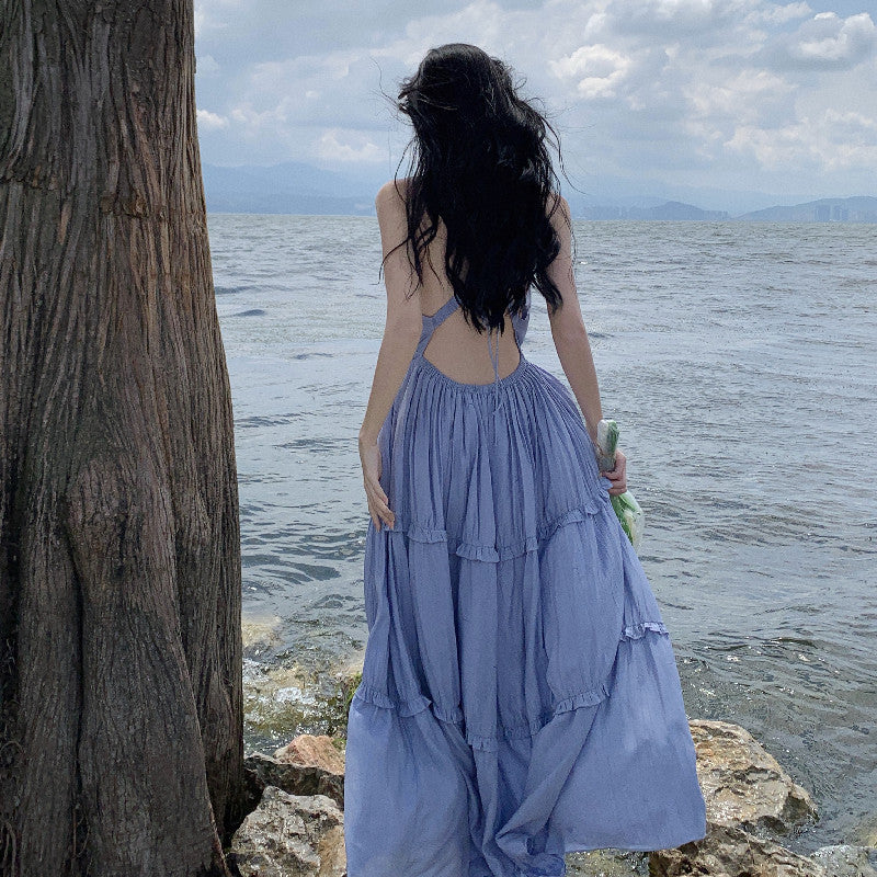 2025 Sanya seaside vacation skirt summer new sexy backless splicing ruffle leaf edge slim pendulum V-neck long skirt suspender skirt