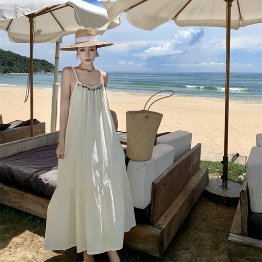 2025 Lazy wind loose suspender skirt women's summer seaside vacation apricot white long skirt Sanya beach skirt backless dress