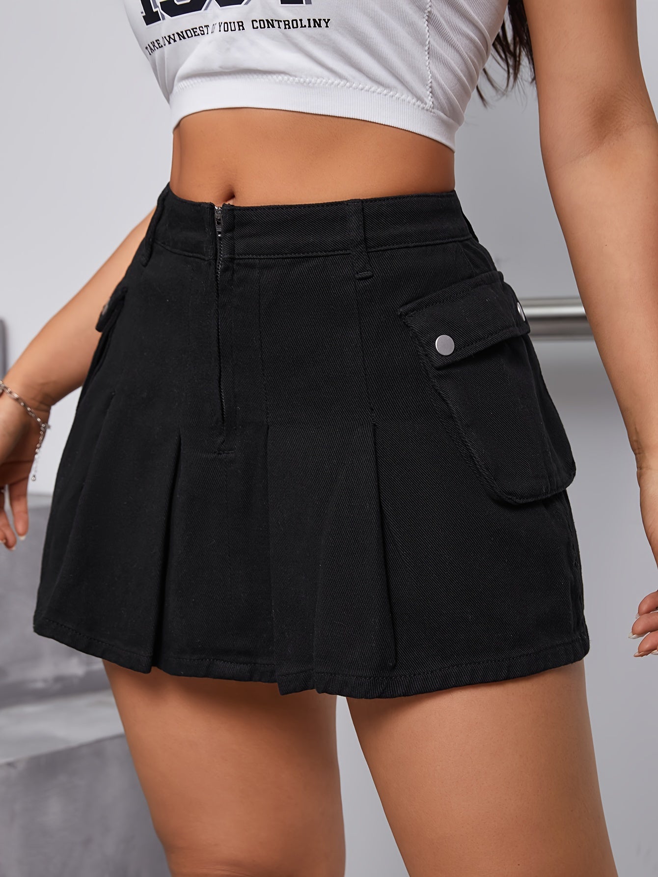 Chic Black Pleated Denim Mini Skirt - Flattering Silhouette with Pockets & Zipper Closure - Versatile Casual Wear for Everyday Style